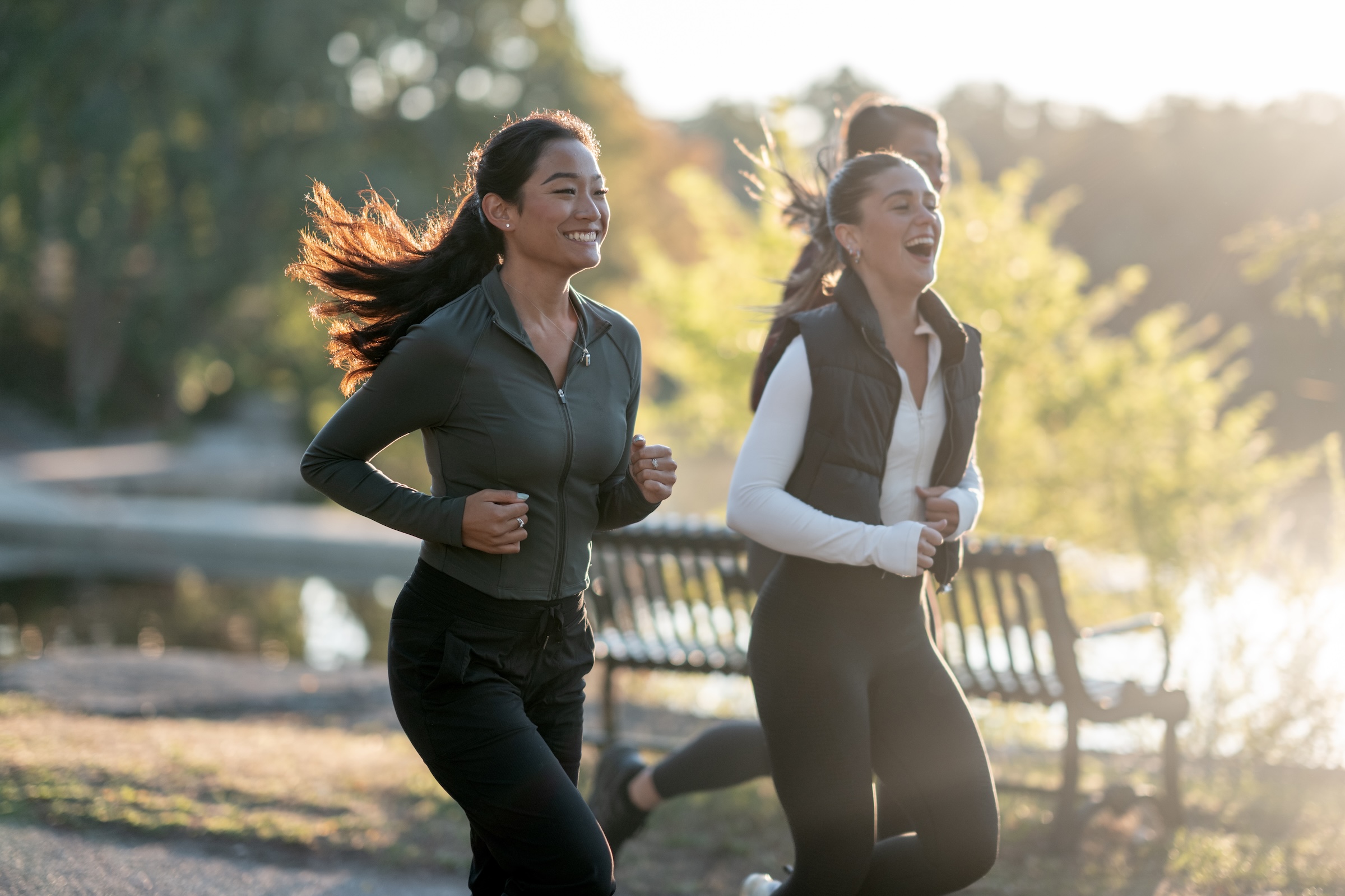 Three people jogging together outdoors
