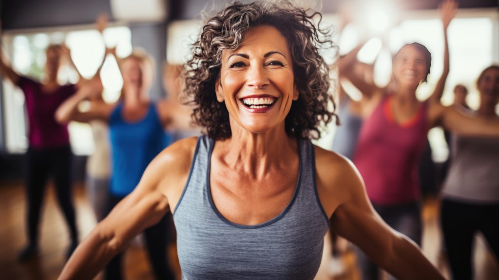 Smiling woman in a group fitness class